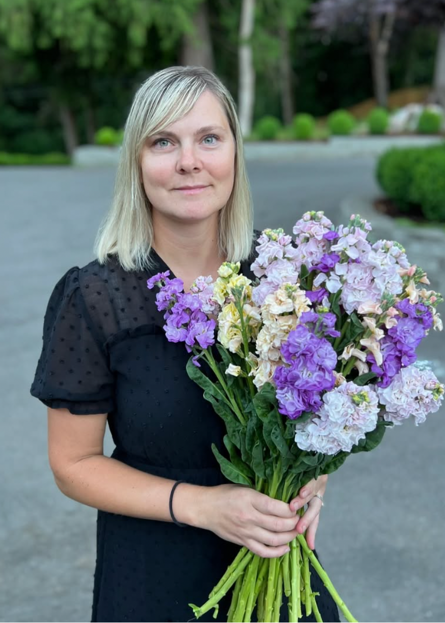 Woman holding a bouquet of flowers outdoors